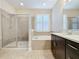 Bathroom boasts a soaking tub, shower, and vanity at 3510 Mediterra Dr, Clermont, FL 34711