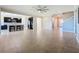 Open living room with tile floors and kitchen island view at 3510 Mediterra Dr, Clermont, FL 34711