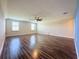 Spacious bonus room with wood-look flooring and ceiling fan at 3510 Mediterra Dr, Clermont, FL 34711