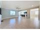 Open living room includes tile floors, a ceiling fan, and an open floor plan at 3510 Mediterra Dr, Clermont, FL 34711