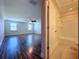 Spacious bedroom with wood-look floors and an ensuite bathroom at 3510 Mediterra Dr, Clermont, FL 34711