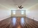 Large bonus room with wood-look floors, ceiling fan and natural light at 3510 Mediterra Dr, Clermont, FL 34711