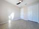 Bright bedroom with double door closet and tile flooring at 3510 Mediterra Dr, Clermont, FL 34711