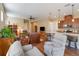 Open concept living room and kitchen with hardwood floors and island at 5006 Sunfalls Ave, Saint Cloud, FL 34772