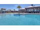 Stunning resort-style pool with ample lounge chairs and a clubhouse at 5006 Sunfalls Ave, Saint Cloud, FL 34772