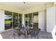 Screened patio with wicker furniture and sliding glass doors at 5006 Sunfalls Ave, Saint Cloud, FL 34772