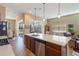 Island kitchen with stainless steel appliances and sliding doors to patio at 5006 Sunfalls Ave, Saint Cloud, FL 34772