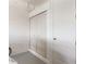 Garage with additional storage and white painted walls at 5006 Sunfalls Ave, Saint Cloud, FL 34772