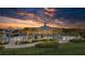 Relax by the resort-style pool at sunset at 5006 Sunfalls Ave, Saint Cloud, FL 34772