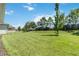 Landscaped backyard with grassy lawn and privacy fence at 5006 Sunfalls Ave, Saint Cloud, FL 34772