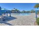 Relaxing resort-style pool with lounge chairs and a poolside cabana at 5006 Sunfalls Ave, Saint Cloud, FL 34772