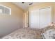 Serene bedroom with a double bed, a private bathroom access, and ample closet space at 5006 Sunfalls Ave, Saint Cloud, FL 34772