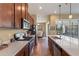 Open concept kitchen boasting stainless steel appliances and ample counter space at 5006 Sunfalls Ave, Saint Cloud, FL 34772