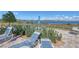 Peaceful pool area with lounge chairs and lake views at 5006 Sunfalls Ave, Saint Cloud, FL 34772