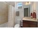 Clean bathroom with shower/tub combo, vanity, and window at 5006 Sunfalls Ave, Saint Cloud, FL 34772