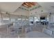 Outdoor kitchen and grilling area with seating and fireplace at 5006 Sunfalls Ave, Saint Cloud, FL 34772