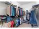 Large walk-in closet with ample shelving and hanging space for clothes and shoes at 5006 Sunfalls Ave, Saint Cloud, FL 34772