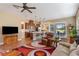 Open concept living area with kitchen, dining, and access to lanai at 5006 Sunfalls Ave, Saint Cloud, FL 34772
