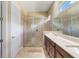 Spa-like bathroom with dual vanities, a large shower, and an updated design at 5006 Sunfalls Ave, Saint Cloud, FL 34772