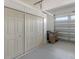 Garage with built-in storage cabinets and space for bins at 5006 Sunfalls Ave, Saint Cloud, FL 34772