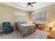 Cozy bedroom with a comfortable bed, window seating, and built-in desk at 5006 Sunfalls Ave, Saint Cloud, FL 34772