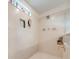 Large walk-in shower with built-in shelves and seat at 2867 Matera Dr, St Cloud, FL 34771
