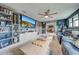 Game room features a large TV, comfortable seating, and built-in shelving at 2867 Matera Dr, St Cloud, FL 34771