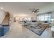 Open living space featuring a spacious sectional sofa and large windows at 2867 Matera Dr, St Cloud, FL 34771
