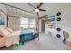 Spacious bedroom with a large bed and built-in shelving at 2867 Matera Dr, St Cloud, FL 34771