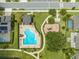 Aerial view of community pool, playground, and surrounding homes at 2867 Matera Dr, St Cloud, FL 34771