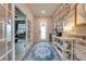 Bright entryway with French doors, a rug, and a console table at 2867 Matera Dr, St Cloud, FL 34771