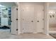 Hallway with linen closet and access to bedrooms at 2867 Matera Dr, St Cloud, FL 34771