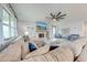 Large living room with comfortable seating, a fireplace, and a large TV at 2867 Matera Dr, St Cloud, FL 34771
