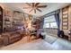 Home office with comfortable seating, large desk, and abundant storage at 2867 Matera Dr, St Cloud, FL 34771