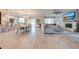Open concept dining room with large table and access to kitchen and living room at 2867 Matera Dr, St Cloud, FL 34771