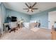 Serene bedroom with a workspace and ceiling fan at 2867 Matera Dr, St Cloud, FL 34771