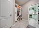 Bright hallway with built-in storage and access to laundry at 2867 Matera Dr, St Cloud, FL 34771