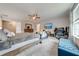 Spacious bedroom with large bed, ceiling fan, and workspace at 2867 Matera Dr, St Cloud, FL 34771