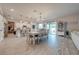 Bright dining room with a large table and chairs, adjacent to kitchen at 2867 Matera Dr, St Cloud, FL 34771