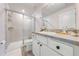 Clean bathroom with a walk-in shower, toilet and modern vanity at 2867 Matera Dr, St Cloud, FL 34771