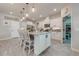 Well-equipped kitchen with island seating and white cabinetry at 2867 Matera Dr, St Cloud, FL 34771