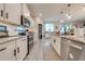Spacious kitchen featuring granite countertops, stainless steel appliances, and ample cabinetry at 2867 Matera Dr, St Cloud, FL 34771