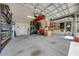 Organized garage with overhead storage and workbench at 2867 Matera Dr, St Cloud, FL 34771