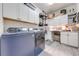 Bright laundry room with washer, dryer, and additional storage at 2867 Matera Dr, St Cloud, FL 34771