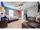 Cozy bedroom with a gaming setup and a desk at 2867 Matera Dr, St Cloud, FL 34771