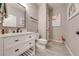 Modern bathroom with white vanity, gray tile floor, and flamingo decor at 2867 Matera Dr, St Cloud, FL 34771