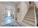 Inviting entryway with staircase and decorative wall accents at 2867 Matera Dr, St Cloud, FL 34771