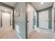Gray hallway with carpet flooring and access to bedrooms at 2867 Matera Dr, St Cloud, FL 34771