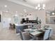 Modern dining area with kitchen and island views at 3171 Paradox Cir # 403, Kissimmee, FL 34746