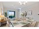 Open concept dining room with living room view at 3171 Paradox Cir # 403, Kissimmee, FL 34746